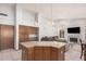 The kitchen opens up to the living room, with a large island for entertaining at 9414 S La Rosa Dr, Tempe, AZ 85284