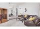 Cozy living room featuring plush seating and neutral carpeting at 9414 S La Rosa Dr, Tempe, AZ 85284