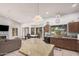 Kitchen with an island open to the dining room and living room at 9414 S La Rosa Dr, Tempe, AZ 85284