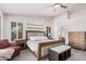 Cozy main bedroom featuring a comfortable bed, ceiling fan, and bright natural light at 9414 S La Rosa Dr, Tempe, AZ 85284