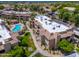 High-angle view of the community highlighting its well-maintained grounds, pool area, and building design at 9450 E Becker Ln # 1071, Scottsdale, AZ 85260