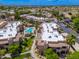Drone shot showcasing the community, pool, landscaping, and complex layout at 9450 E Becker Ln # 1071, Scottsdale, AZ 85260