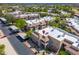 Aerial view of the community featuring large condo buildings, parking areas, and manicured landscaping at 9450 E Becker Ln # 1071, Scottsdale, AZ 85260