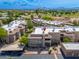 Aerial view of the community featuring large condo buildings, green spaces, and mountain views at 9450 E Becker Ln # 1071, Scottsdale, AZ 85260