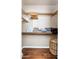 Walk in closet featuring custom shelves, wood floors, and hanging rods at 9450 E Becker Ln # 1071, Scottsdale, AZ 85260