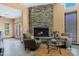 Cozy common area with a stone fireplace and comfortable seating arrangement at 9450 E Becker Ln # 1071, Scottsdale, AZ 85260