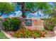 Aventura community sign with blooming flowers and well-maintained landscaping at 9450 E Becker Ln # 1071, Scottsdale, AZ 85260
