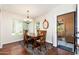 Elegant dining room with wood table and chairs, chandelier, and natural light at 9450 E Becker Ln # 1071, Scottsdale, AZ 85260