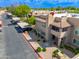 Scenic view of the condo exterior with covered parking and landscaped common areas at 9450 E Becker Ln # 1071, Scottsdale, AZ 85260