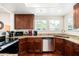 Bright kitchen with stainless steel appliances, granite countertops, wood cabinets at 9450 E Becker Ln # 1071, Scottsdale, AZ 85260