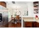 Bright kitchen with stainless steel fridge, granite countertops, and view into dining room at 9450 E Becker Ln # 1071, Scottsdale, AZ 85260