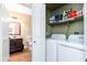 View of the laundry room and half bathroom located off the laundry room at 9450 E Becker Ln # 1071, Scottsdale, AZ 85260