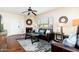 Charming living room with a fireplace, hardwood floors, natural light, and comfortable seating at 9450 E Becker Ln # 1071, Scottsdale, AZ 85260