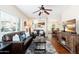 Bright living room with modern decor, hardwood floors, a ceiling fan, and ample natural light at 9450 E Becker Ln # 1071, Scottsdale, AZ 85260