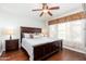 Spacious main bedroom featuring a king-sized bed, ceiling fan, and natural light at 9450 E Becker Ln # 1071, Scottsdale, AZ 85260