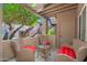 Serene patio with comfortable wicker seating, offering a relaxing outdoor space to unwind at 9450 E Becker Ln # 1071, Scottsdale, AZ 85260