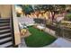 Digitally staged backyard featuring green turf and an outdoor seating area for relaxing or entertaining at 9551 E Redfield Rd # 1061, Scottsdale, AZ 85260