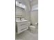 Bright bathroom featuring a modern vanity with undermount sink and white tile flooring at 9551 E Redfield Rd # 1061, Scottsdale, AZ 85260