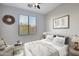 Digitally staged bedroom featuring neutral decor, a large window for natural light, and comfortable bedding at 9551 E Redfield Rd # 1061, Scottsdale, AZ 85260