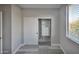 Bedroom features a large closet with built-in shelving and drawers, plus a window offering outdoor views at 9551 E Redfield Rd # 1061, Scottsdale, AZ 85260