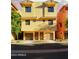 Inviting two-story townhome with tan stucco, dual front doors, and attached garages at 9551 E Redfield Rd # 1061, Scottsdale, AZ 85260