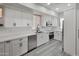 Bright kitchen features white cabinets, stainless steel appliances and sleek countertop and flooring at 9551 E Redfield Rd # 1061, Scottsdale, AZ 85260
