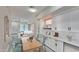 Bright, open-concept kitchen and dining area, featuring white cabinetry and seamless flow into the living area at 9551 E Redfield Rd # 1061, Scottsdale, AZ 85260