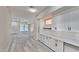 Bright, open-concept kitchen with ample white cabinetry and seamless flow into the living area at 9551 E Redfield Rd # 1061, Scottsdale, AZ 85260