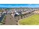 Aerial view of a well-planned community, displaying homes with tiled roofs and desert landscaping at 9677 W Patrick Ln, Peoria, AZ 85383