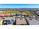 Bird's eye view of a serene neighborhood with a community park, lush landscaping, and mountain views at 9677 W Patrick Ln, Peoria, AZ 85383