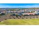 Expansive aerial view showcasing a residential community, nearby park, and picturesque mountain views at 9677 W Patrick Ln, Peoria, AZ 85383