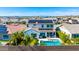 Stunning backyard boasts a refreshing pool, lush palm trees, and patio area for outdoor relaxation at 9677 W Patrick Ln, Peoria, AZ 85383