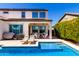 Stunning backyard with a large swimming pool, covered patio, and ample seating at 9677 W Patrick Ln, Peoria, AZ 85383