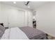 A bedroom features wood floors, a ceiling fan, and a closet at 9677 W Patrick Ln, Peoria, AZ 85383