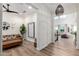 Inviting entryway with stylish decor, hardwood floors, and a view into the spacious living area at 9677 W Patrick Ln, Peoria, AZ 85383