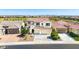Aerial view of a two-story home with three-car garage, tile roof, and mountain views at 9677 W Patrick Ln, Peoria, AZ 85383