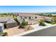 Charming two-story home featuring a tile roof, three-car garage, and desert landscaping at 9677 W Patrick Ln, Peoria, AZ 85383