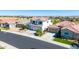 Beautiful two-story home with a three-car garage and well-maintained front yard at 9677 W Patrick Ln, Peoria, AZ 85383