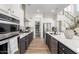 Spacious kitchen features a large island, stainless appliances, walk-in pantry, and elegant finishes at 9677 W Patrick Ln, Peoria, AZ 85383
