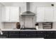 Bright kitchen with stainless steel appliances, stylish backsplash, and modern cabinetry at 9677 W Patrick Ln, Peoria, AZ 85383