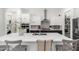 Well-equipped kitchen featuring white cabinets, quartz countertops, and stainless steel appliances at 9677 W Patrick Ln, Peoria, AZ 85383