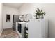 Well-organized laundry room with modern appliances and ample storage space at 9677 W Patrick Ln, Peoria, AZ 85383