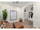 Open-concept living area featuring hardwood floors, decor, and a view into the adjacent rooms at 9677 W Patrick Ln, Peoria, AZ 85383