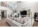 Expansive living room with high ceilings, hardwood floors, and a stylish entertainment area at 9677 W Patrick Ln, Peoria, AZ 85383