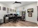 This office features a ceiling fan, wood floors, and plenty of workspace at 9677 W Patrick Ln, Peoria, AZ 85383