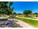 Green community park with walking paths, seating and lush landscaping at 9677 W Patrick Ln, Peoria, AZ 85383