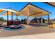 Extensive community playground featuring multiple play areas and shaded seating at 9677 W Patrick Ln, Peoria, AZ 85383