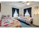 Comfortable bedroom featuring twin beds, bright natural light, and cozy decor at 103 S 75Th Pl, Mesa, AZ 85208