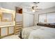 Comfortable bedroom featuring a ceiling fan, closet, and window providing natural light at 103 S 75Th Pl, Mesa, AZ 85208
