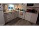 Functional kitchen features white cabinetry, appliances, and ample counter space at 103 S 75Th Pl, Mesa, AZ 85208